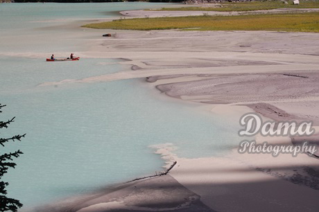 Canoeing. Rock flour carried into the lake by melt-water from the glacier, Lake Louise, Alberta, Canada